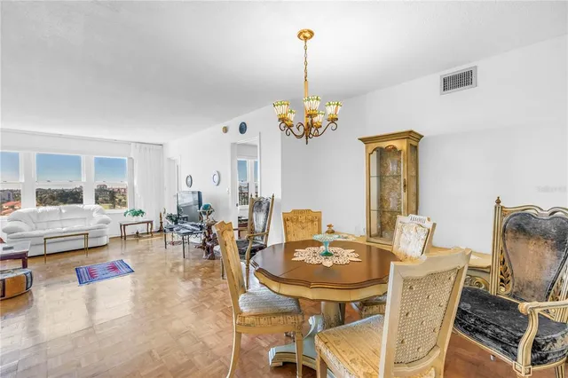 a bedroom with bed and a dresser with mirror