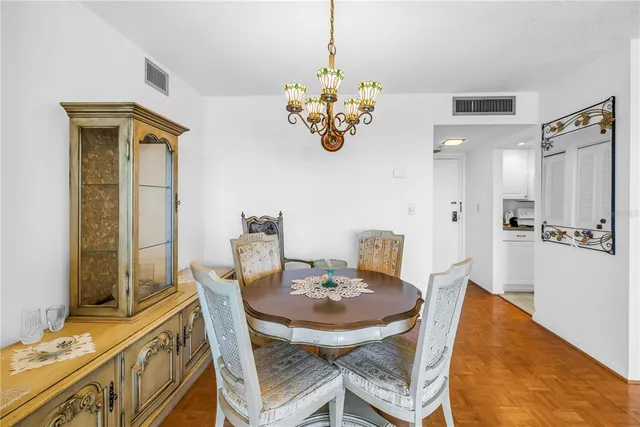 a bedroom with 2 bed and a lamp