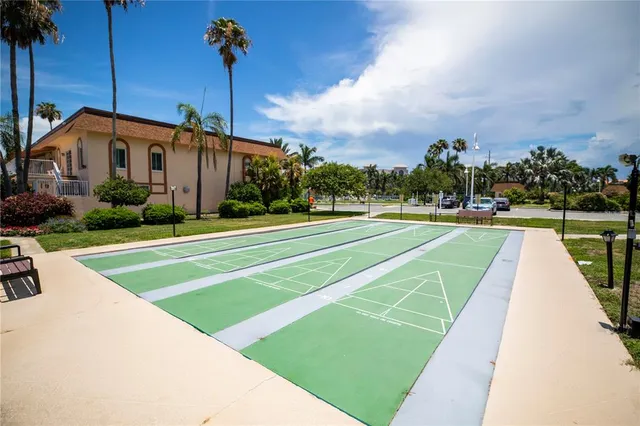 a view of a swimming pool with outdoor seating