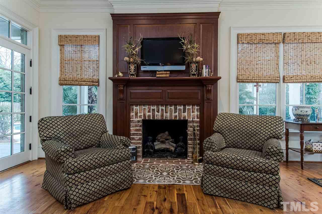 508 Marlowe Road Raleigh, NC 27609 - Photo 11 of 25 a living room with furniture and a fireplace