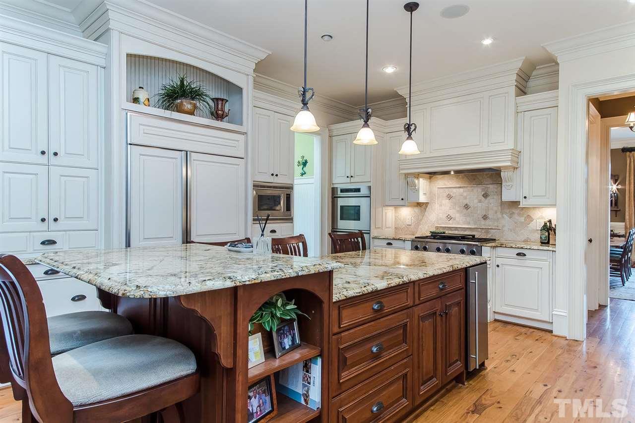 508 Marlowe Road Raleigh, NC 27609 - Photo 14 of 25 a open kitchen with stainless steel appliances granite countertop a stove a sink and a refrigerator
