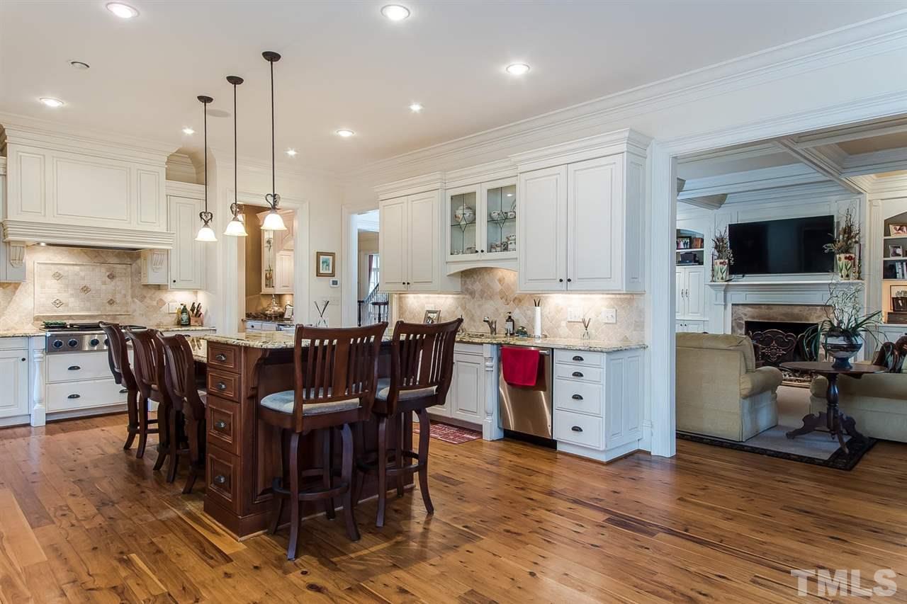 508 Marlowe Road Raleigh, NC 27609 - Photo 17 of 25 a large kitchen with a table and chairs