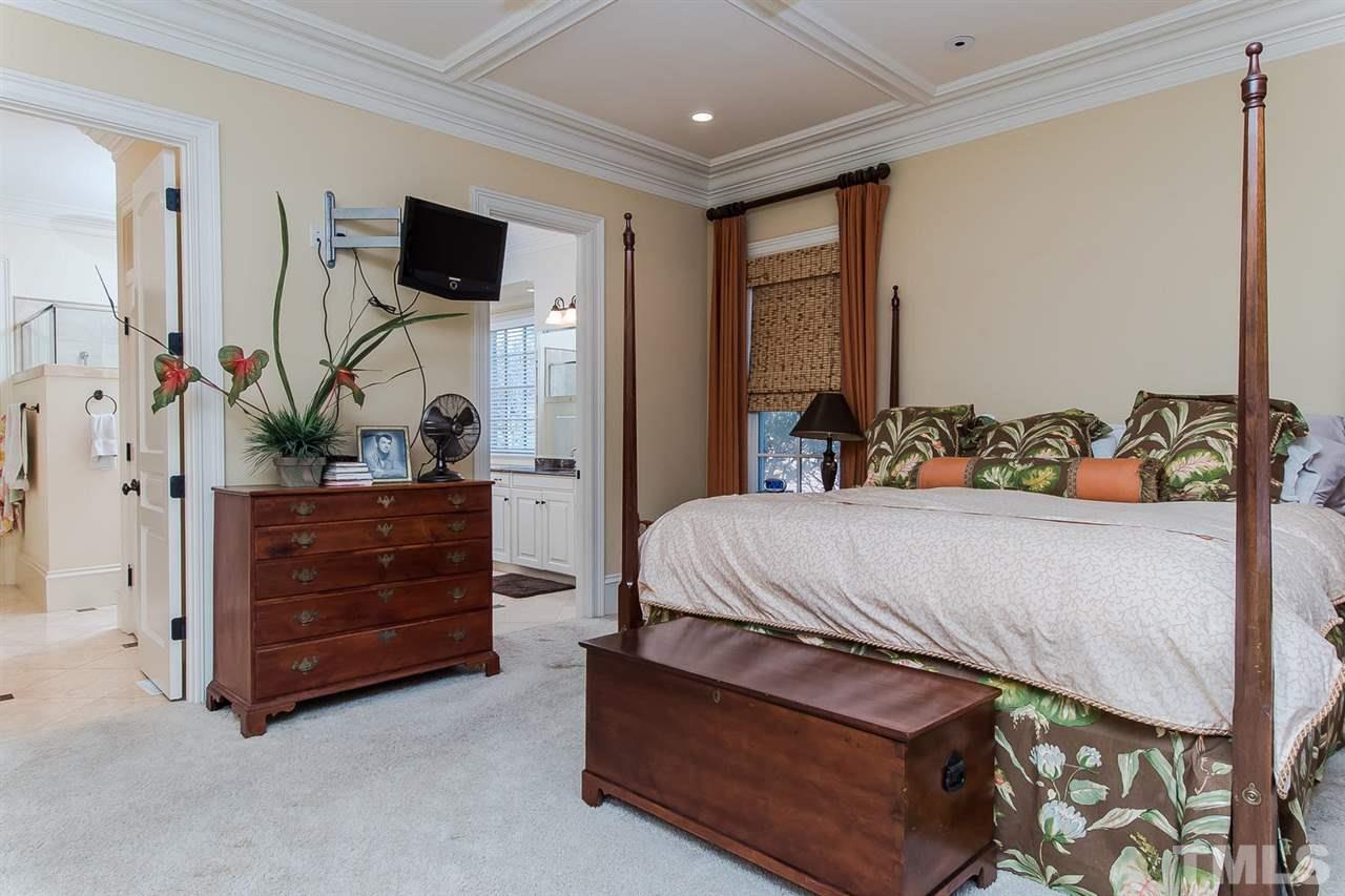 508 Marlowe Road Raleigh, NC 27609 - Photo 20 of 25 a bedroom with a bed and a flat tv screen