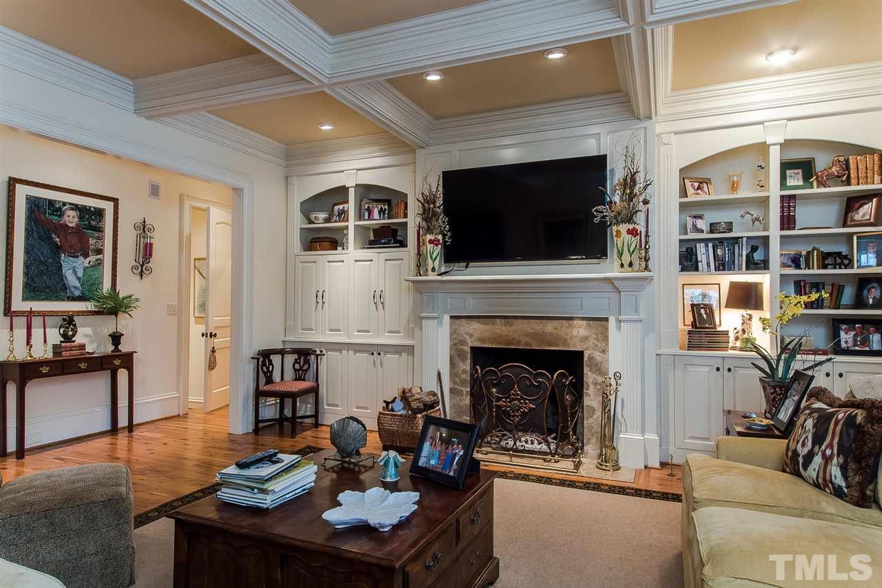 508 Marlowe Road Raleigh, NC 27609 - Photo 8 of 25 a living room with furniture a flat screen tv and a fireplace