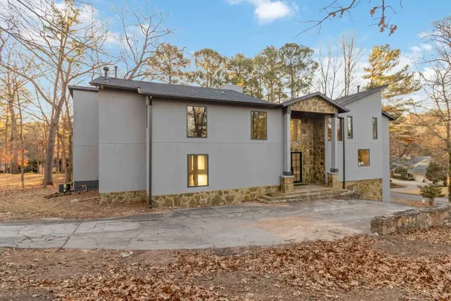 a view of a house with a snow on the road
