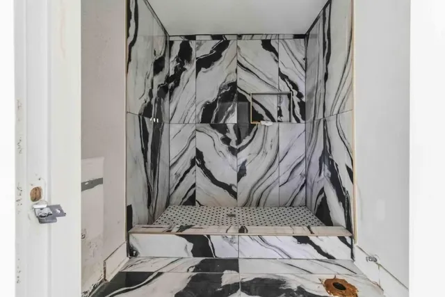 a bathroom with a bathtub and toilet