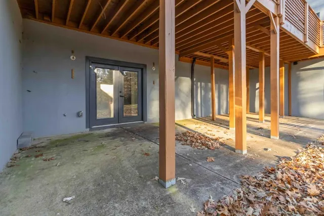 a view of a house with backyard stove and sitting area