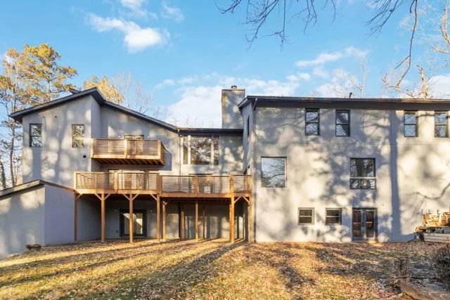 a view of balcony with wooden floor and fence