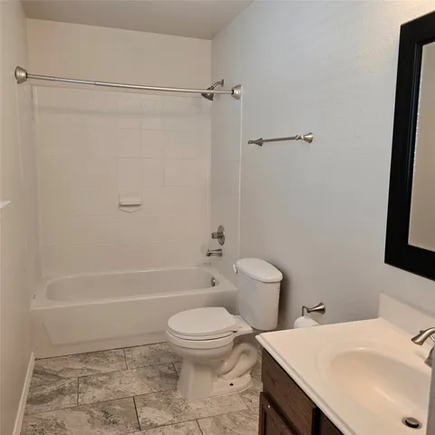 a front view of a house with a yard and a window