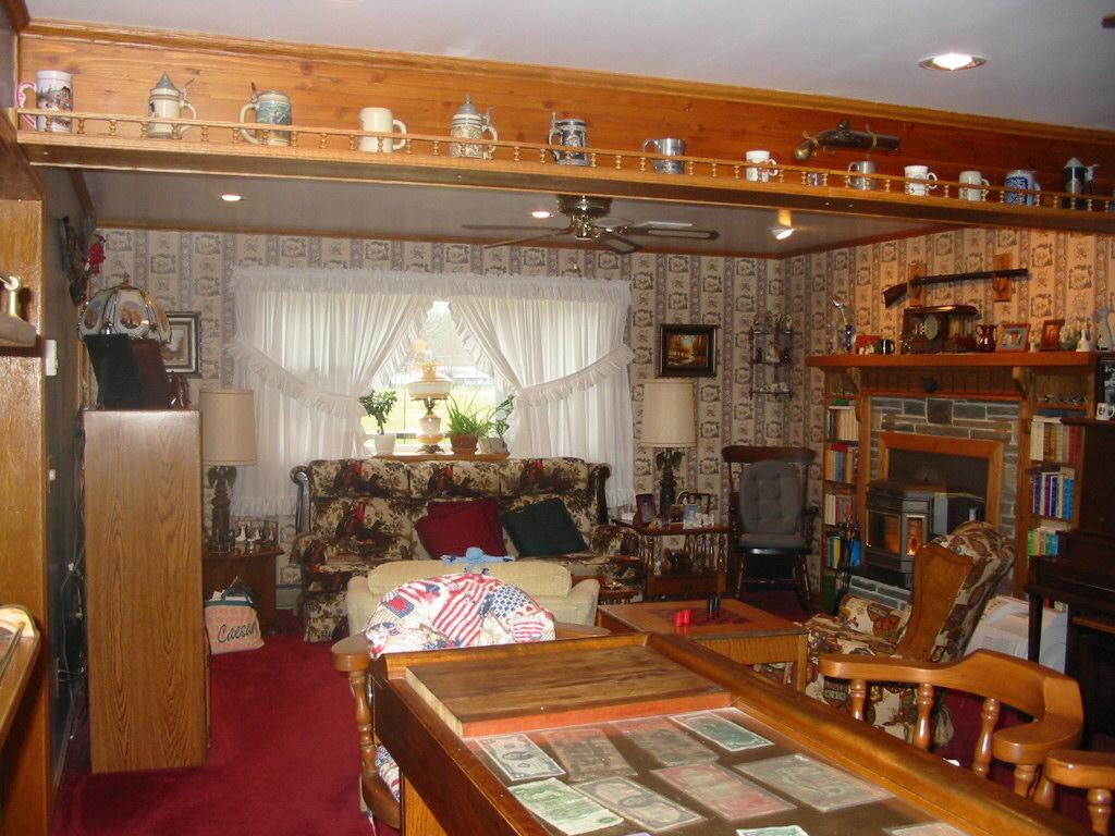 46 Fairgrounds Road Gilbert, PA 18331 - Photo 3 of 8 a living room with furniture a flat screen tv and a fireplace