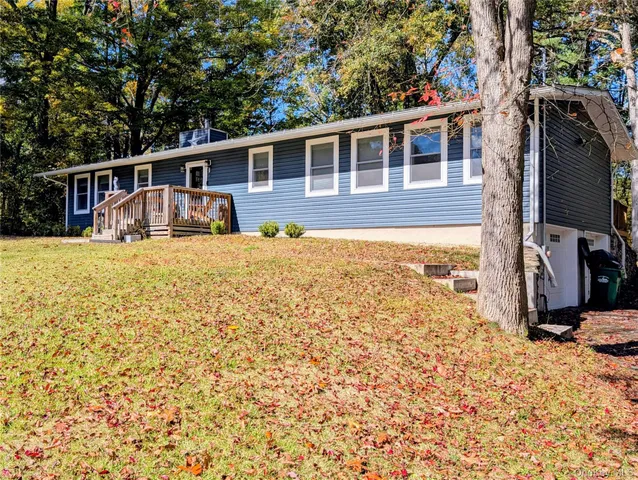 a kitchen with kitchen island granite countertop a sink appliances and cabinets