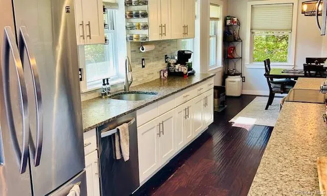 a kitchen with a sink stove and refrigerator