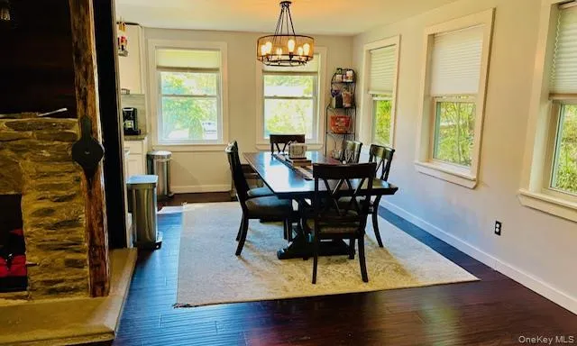 a living room with fireplace furniture and a flat screen tv