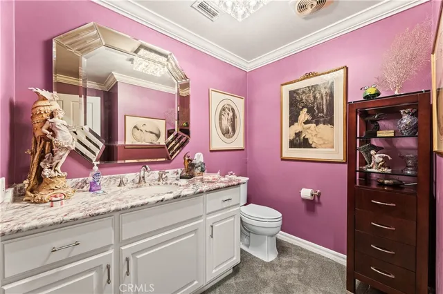 a bathroom with a sink a vanity and a mirror