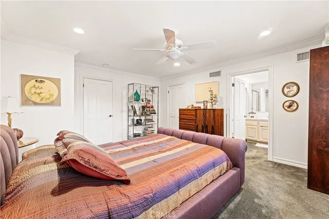 a bedroom with a bed and a walk in closet