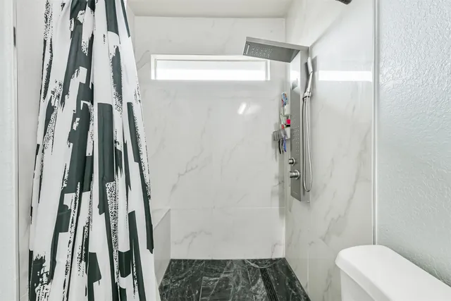 a bathroom with a sink and toilet