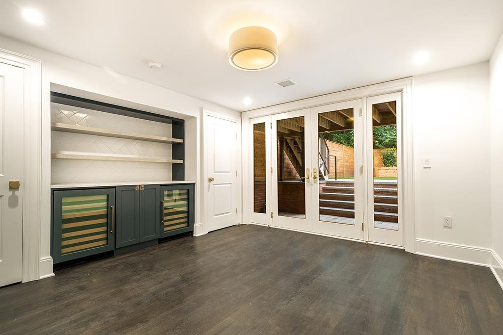 206 8th Street Hoboken, NJ 07030 - Photo 18 of 35 an empty room with wooden floor and windows