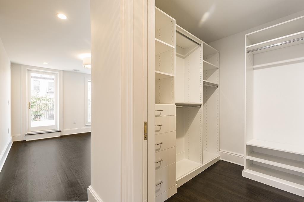 206 8th Street Hoboken, NJ 07030 - Photo 20 of 35 an empty room with wooden floor and windows