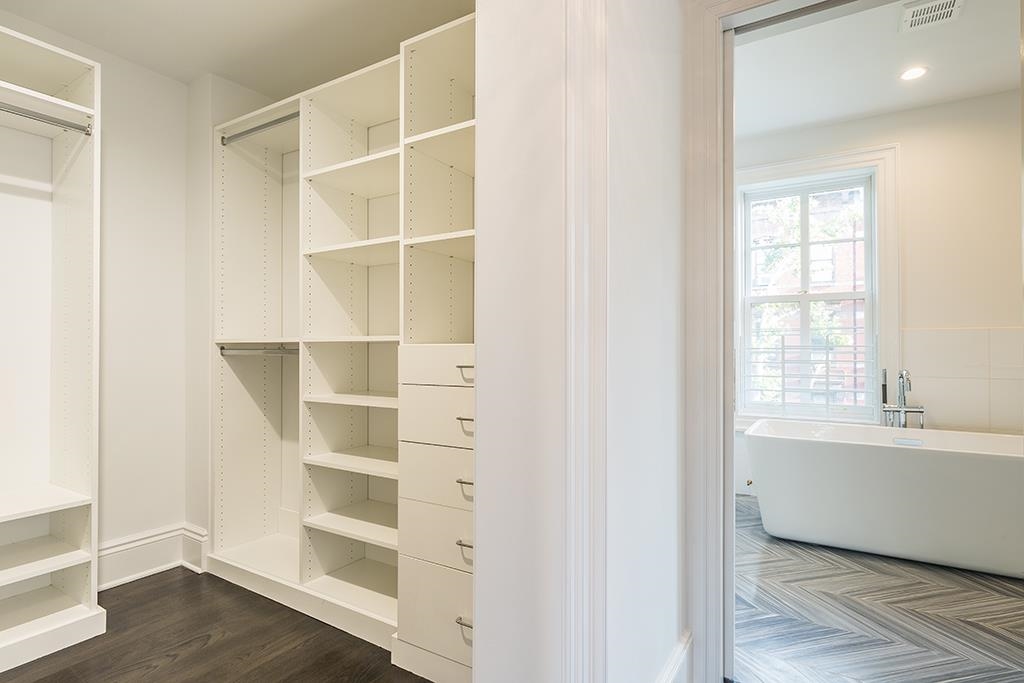 206 8th Street Hoboken, NJ 07030 - Photo 21 of 35 a view of an empty room with wooden floor and windows