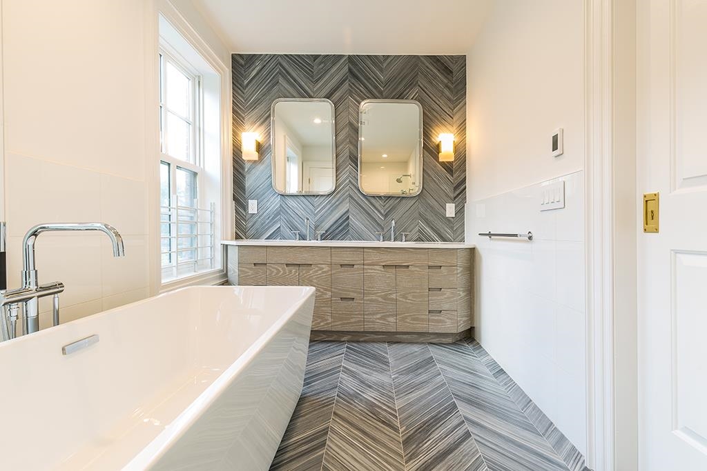 206 8th Street Hoboken, NJ 07030 - Photo 22 of 35 a spacious bathroom with a double vanity sink and a mirror