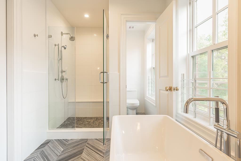 206 8th Street Hoboken, NJ 07030 - Photo 23 of 35 a bathroom with a tub shower and sink