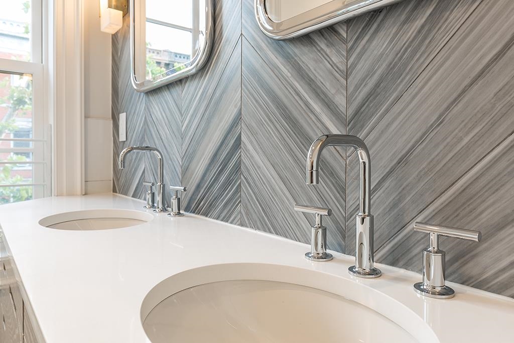 206 8th Street Hoboken, NJ 07030 - Photo 26 of 35 a bathroom with a sink and a mirror