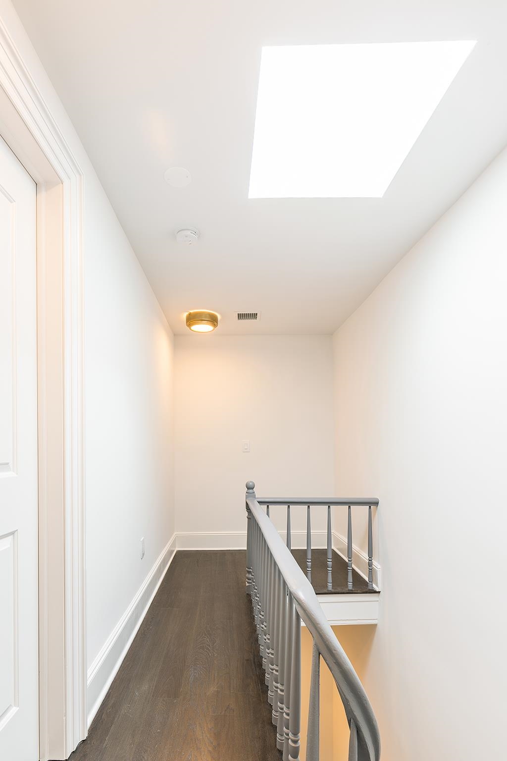 206 8th Street Hoboken, NJ 07030 - Photo 27 of 35 a view of a hallway with staircase