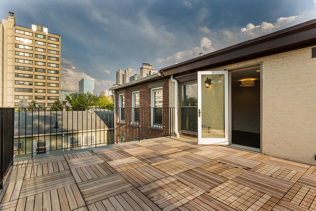 206 8th Street Hoboken, NJ 07030 - Photo 30 of 35 a view of a balcony with a floor to ceiling window