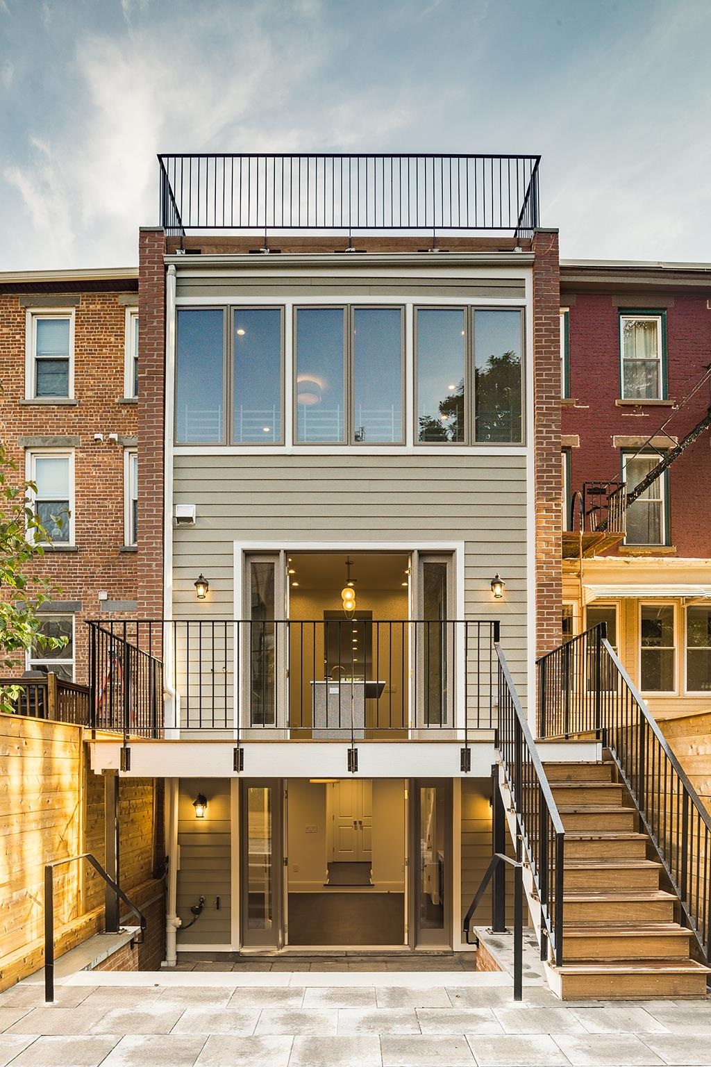206 8th Street Hoboken, NJ 07030 - Photo 33 of 35 a view of a house with a deck