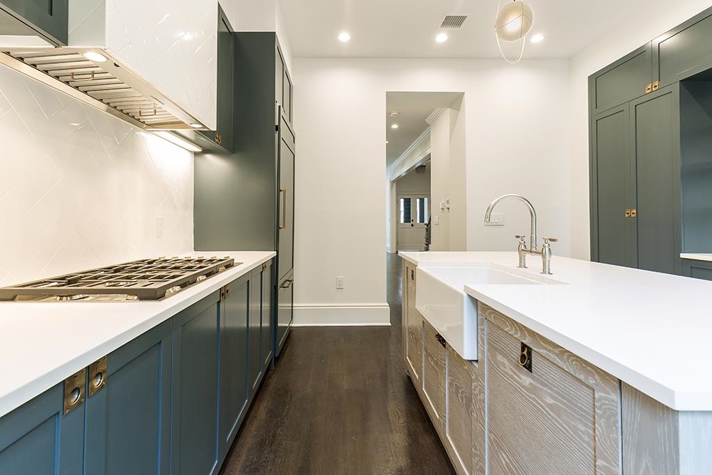 206 8th Street Hoboken, NJ 07030 - Photo 7 of 35 a kitchen with a sink and a stove top oven