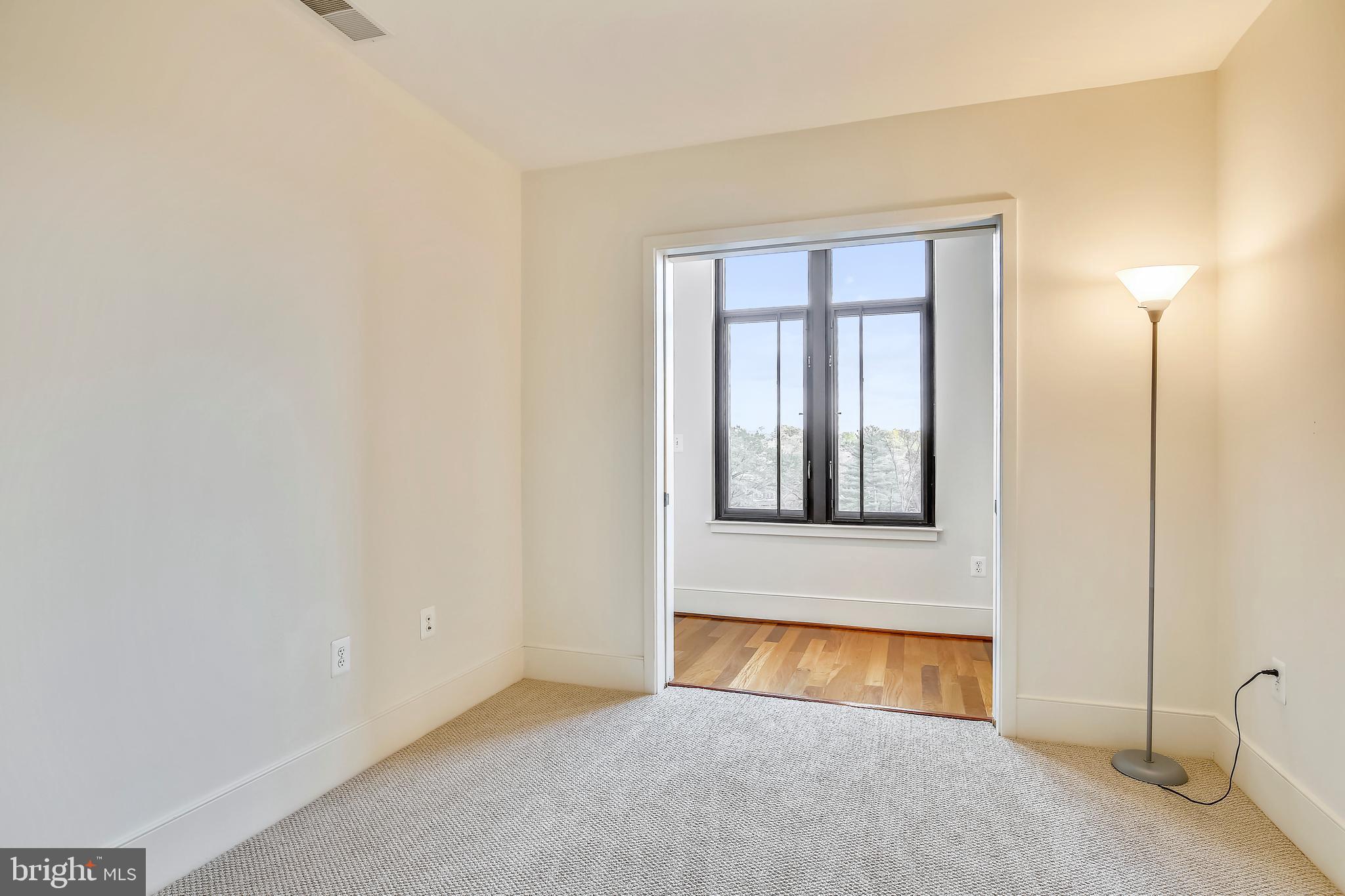 4301 Military Road Northwest, Unit PH5 Washington, DC 20015 - Photo 17 of 53 a view of an empty room with window