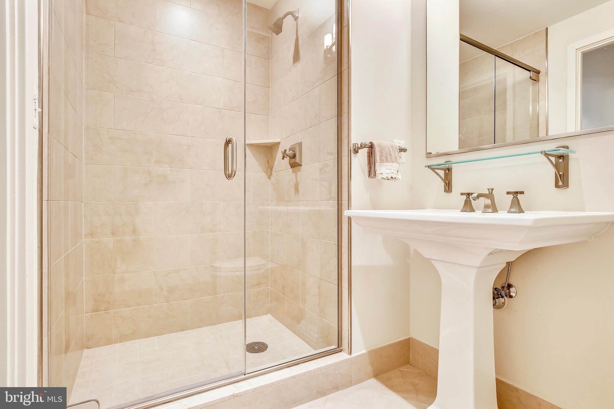 4301 Military Road Northwest, Unit PH5 Washington, DC 20015 - Photo 19 of 53 a bathroom with a sink and a mirror