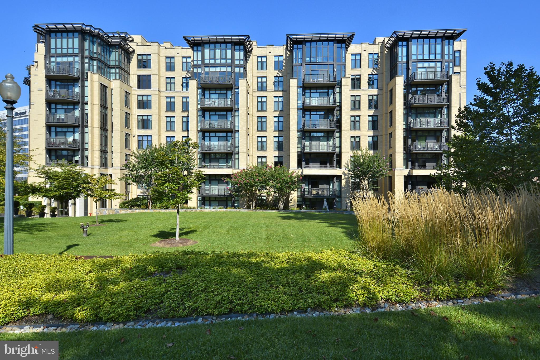 4301 Military Road Northwest, Unit PH5 Washington, DC 20015 - Photo 2 of 53 a view of building with yard and green space