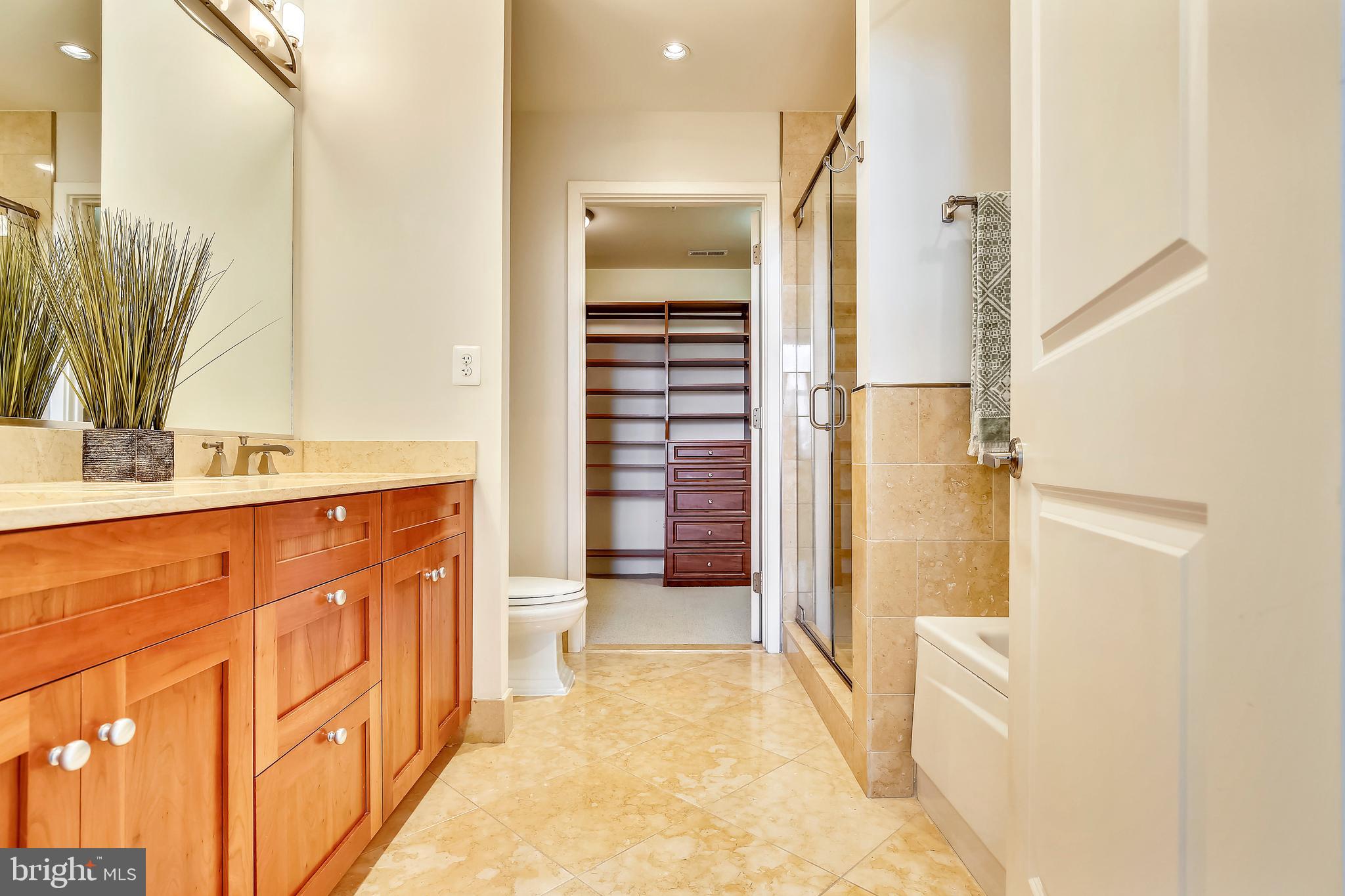 4301 Military Road Northwest, Unit PH5 Washington, DC 20015 - Photo 27 of 53 a bathroom with a sink and a mirror