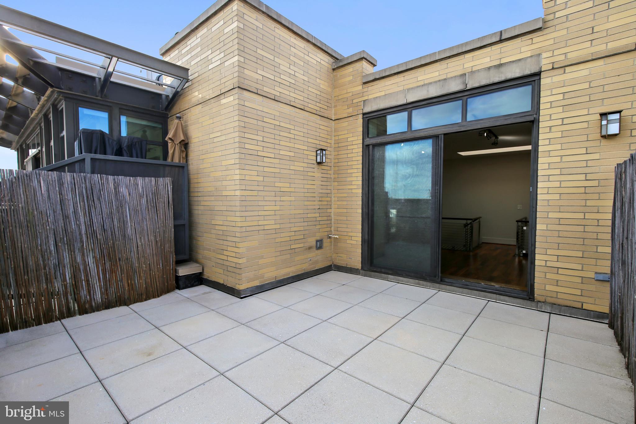 4301 Military Road Northwest, Unit PH5 Washington, DC 20015 - Photo 34 of 53 a view of a house with backyard