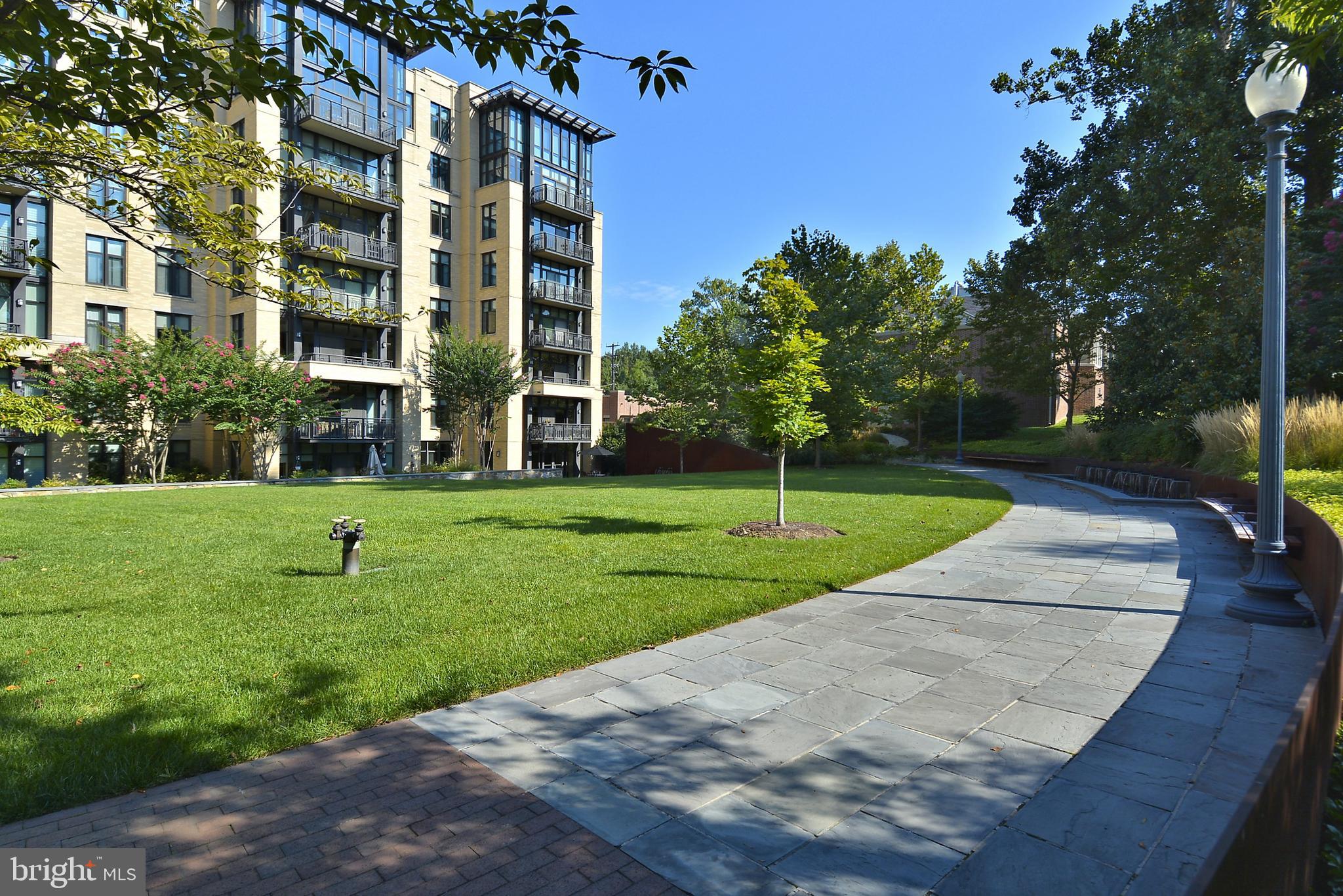 4301 Military Road Northwest, Unit PH5 Washington, DC 20015 - Photo 43 of 53 a view of a building with a yard