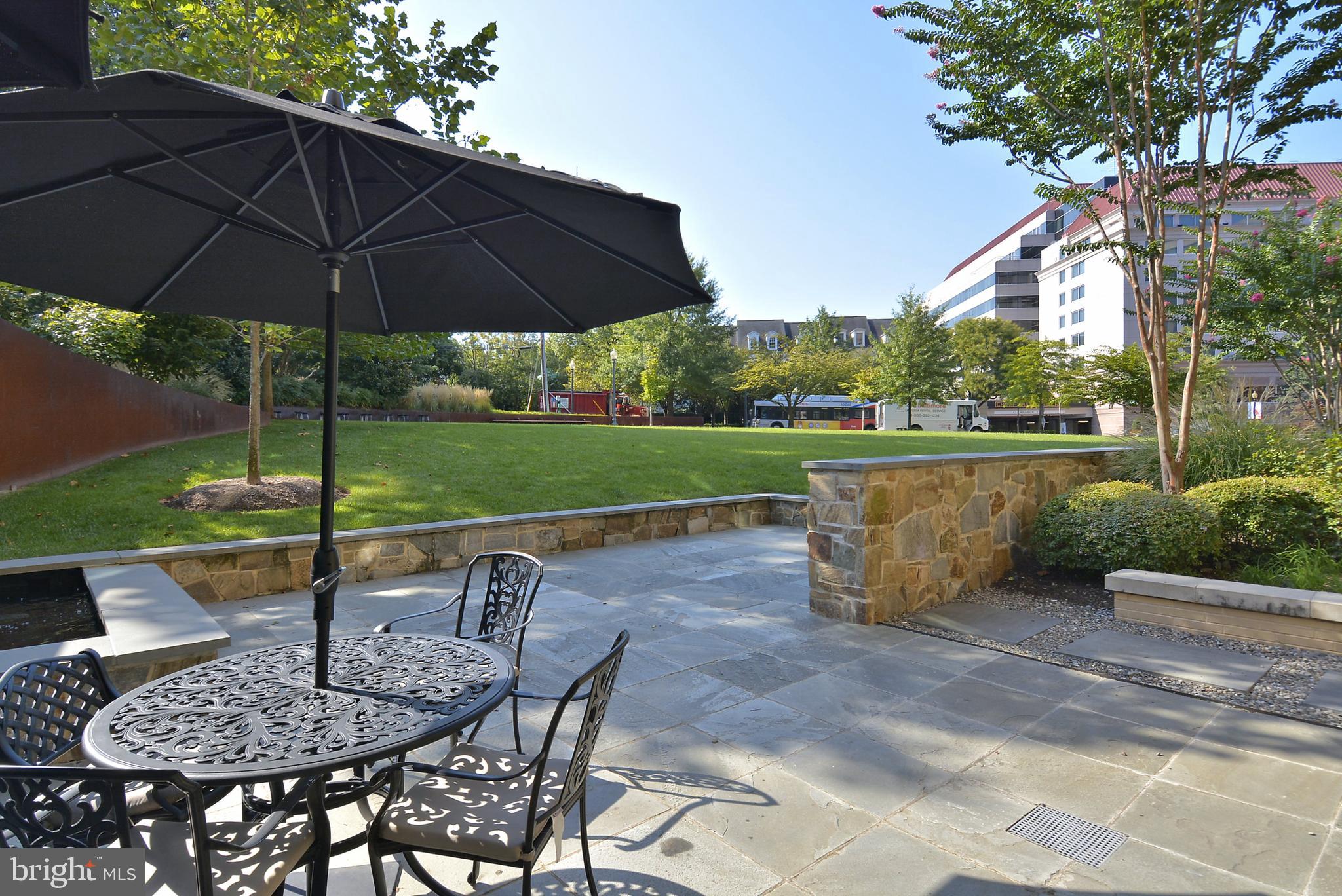 4301 Military Road Northwest, Unit PH5 Washington, DC 20015 - Photo 44 of 53 a view of backyard with outdoor seating and green space