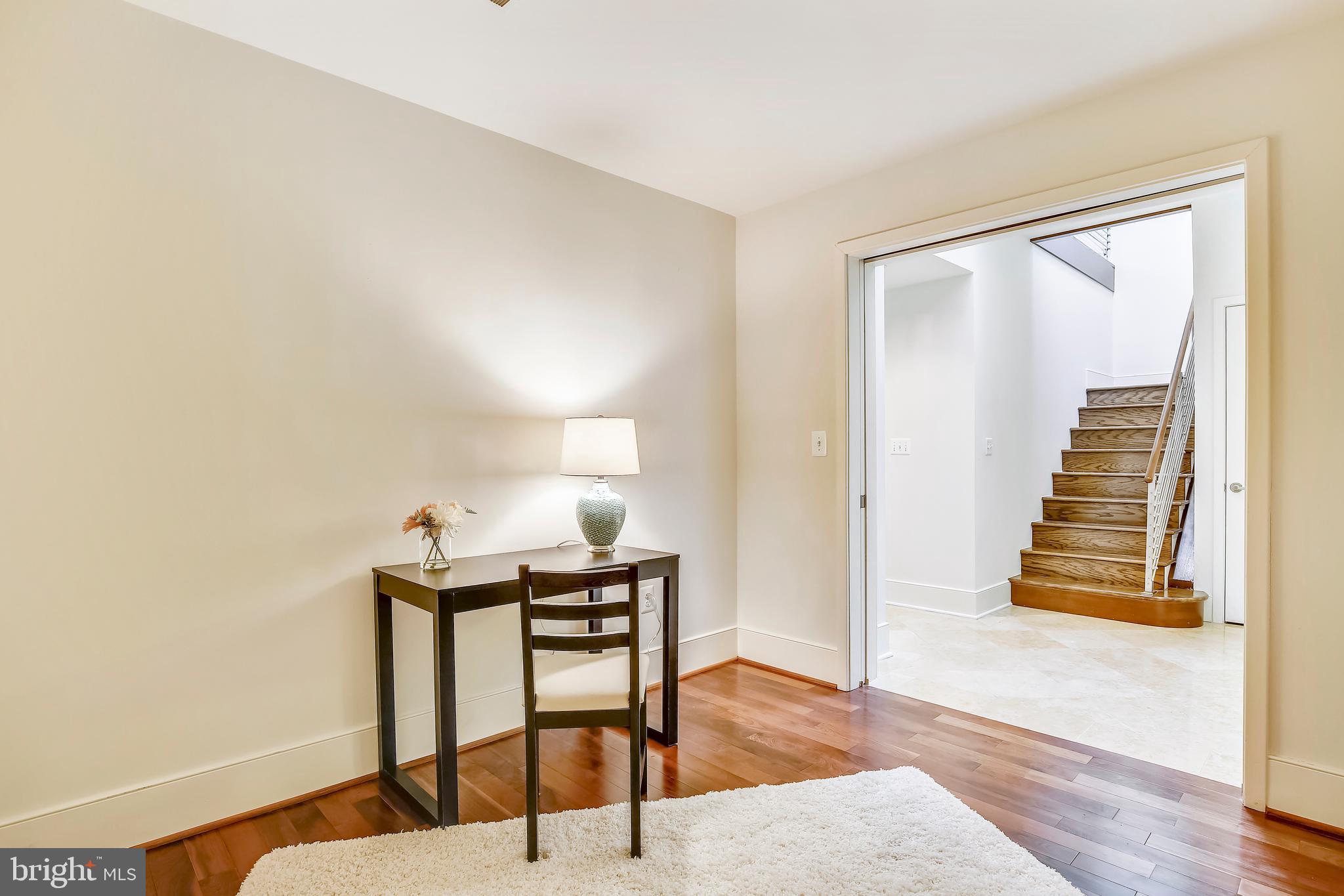 4301 Military Road Northwest, Unit PH5 Washington, DC 20015 - Photo 5 of 53 a view of a livingroom with furniture and wooden floor