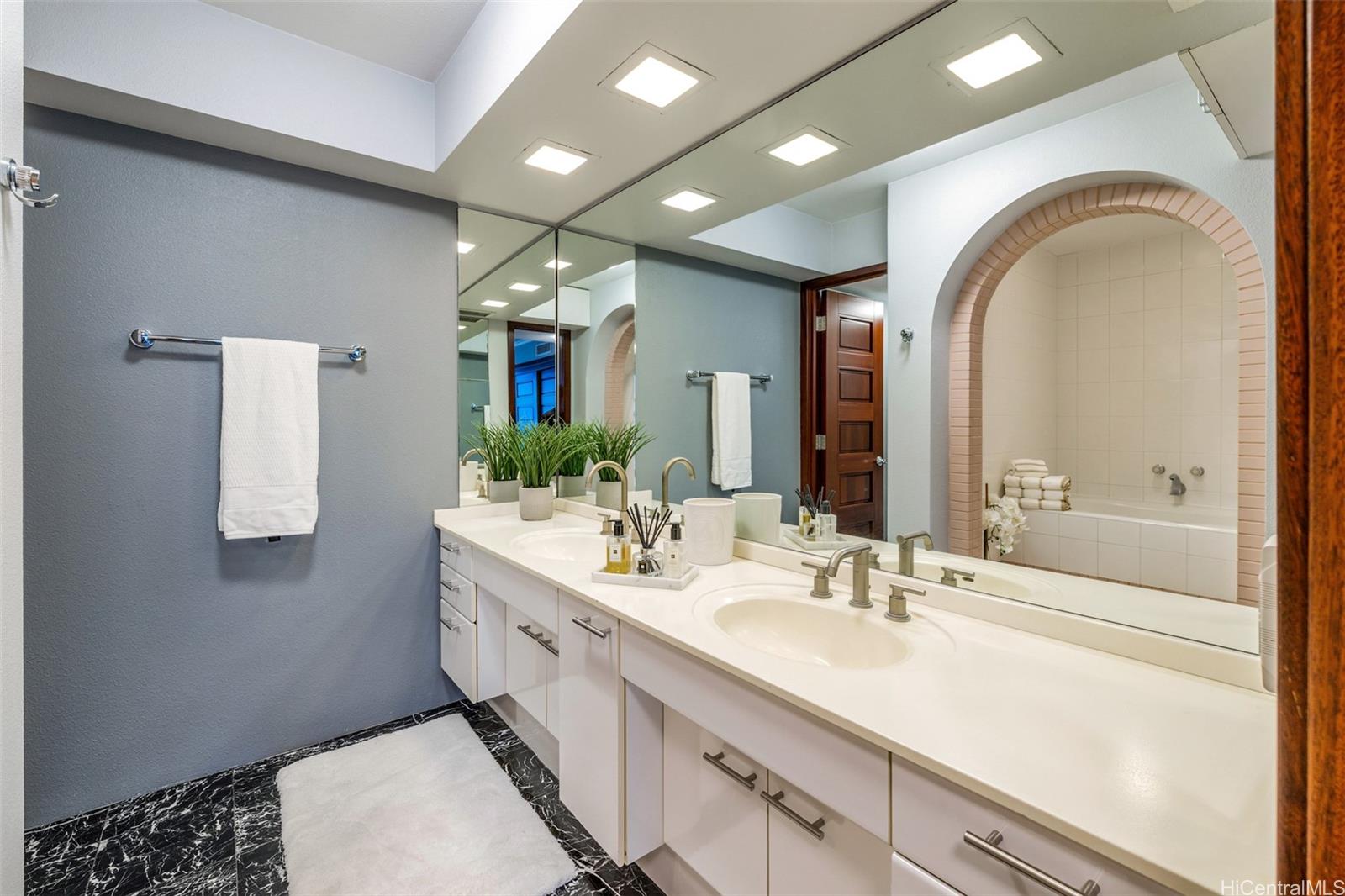 415 South Street, Unit 4202 Honolulu, HI 96813 - Photo 13 of 21 a spacious bathroom with a double vanity sink and a mirror