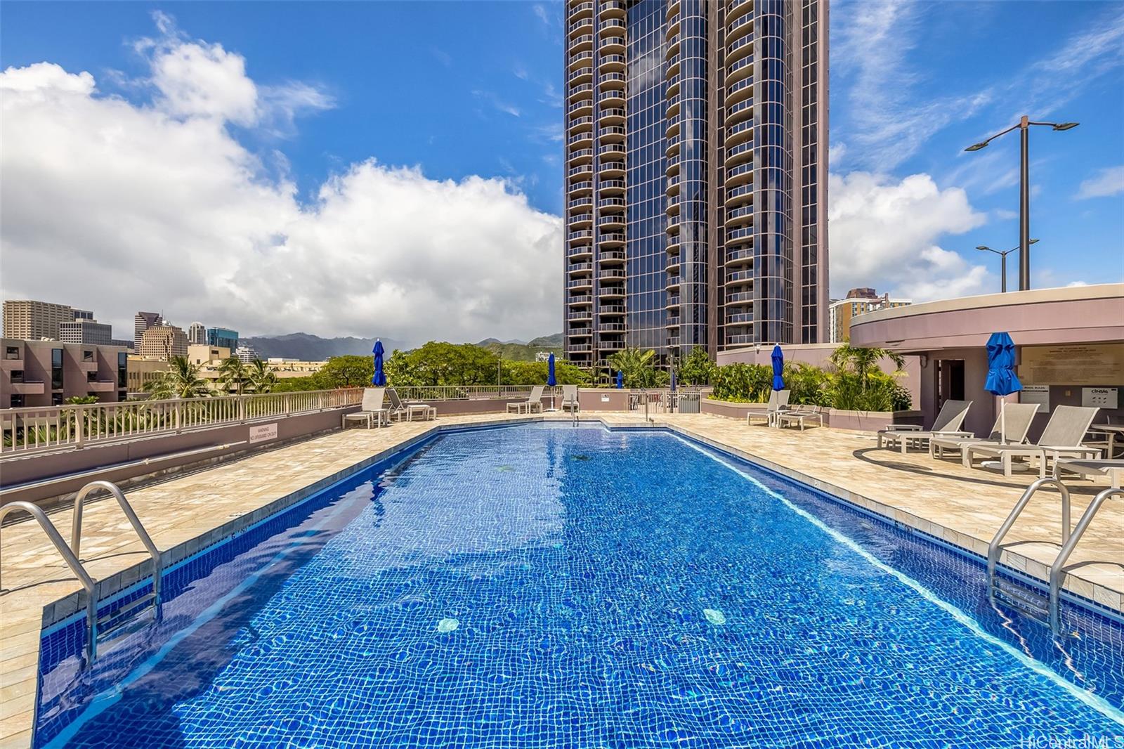 415 South Street, Unit 4202 Honolulu, HI 96813 - Photo 18 of 21 a view of swimming pool with outdoor seating and plants