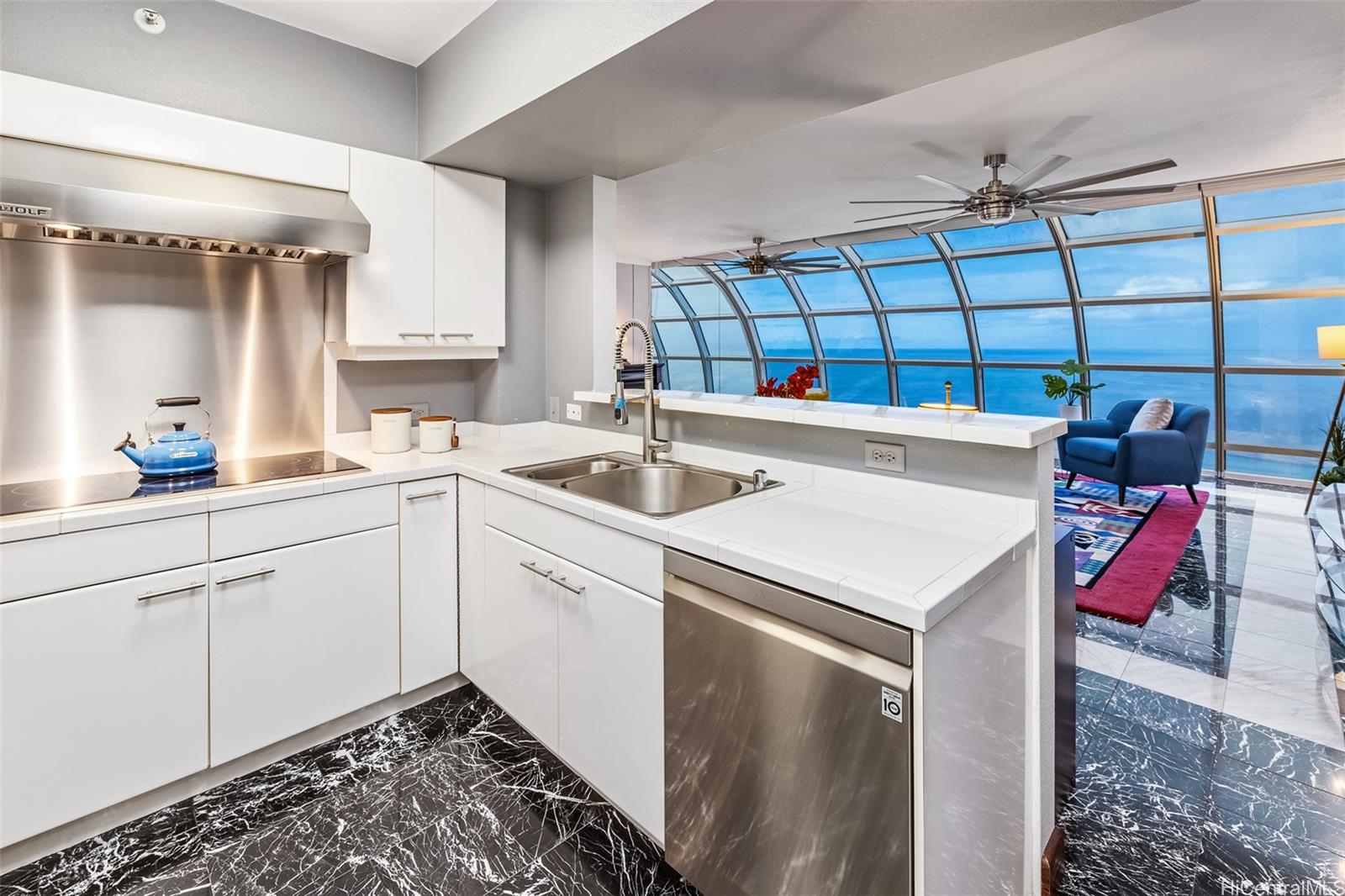 415 South Street, Unit 4202 Honolulu, HI 96813 - Photo 10 of 21 a kitchen with a sink and cabinets