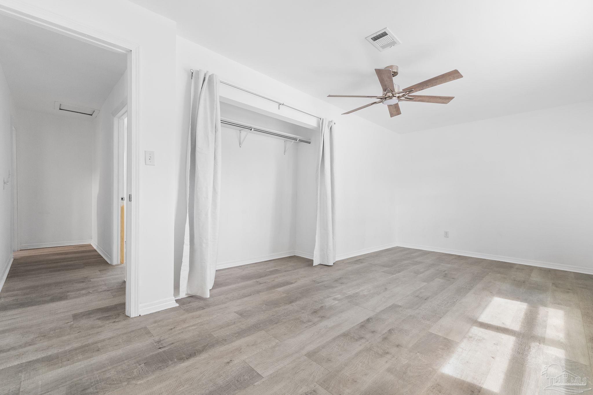 1890 Handy Road Cantonment, FL 32533 - Photo 15 of 28 a view of empty room with wooden floor