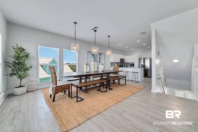 1492 Shell Lane Gulf Shores, AL 36542 - Photo 7 of 20 Dining area with light wood-style floors and recessed lighting