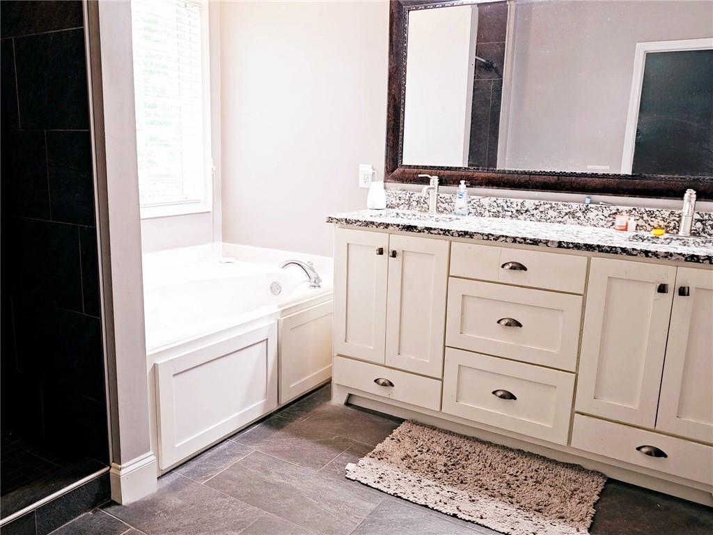 147 Crest Winds Drive Clarkesville, GA 30523 - Photo 11 of 17 a bathroom with a sink and a mirror