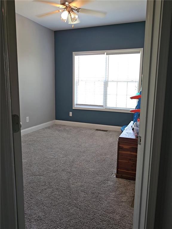 147 Crest Winds Drive Clarkesville, GA 30523 - Photo 12 of 17 a bathroom with a bathtub and a window