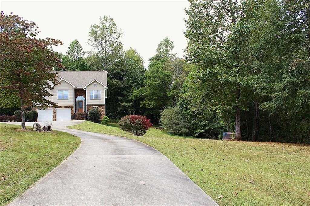 147 Crest Winds Drive Clarkesville, GA 30523 - Photo 17 of 17 a front view of a house with a yard and trees