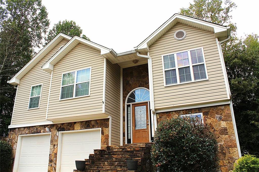 147 Crest Winds Drive Clarkesville, GA 30523 - Photo 3 of 17 a front view of a house with a yard