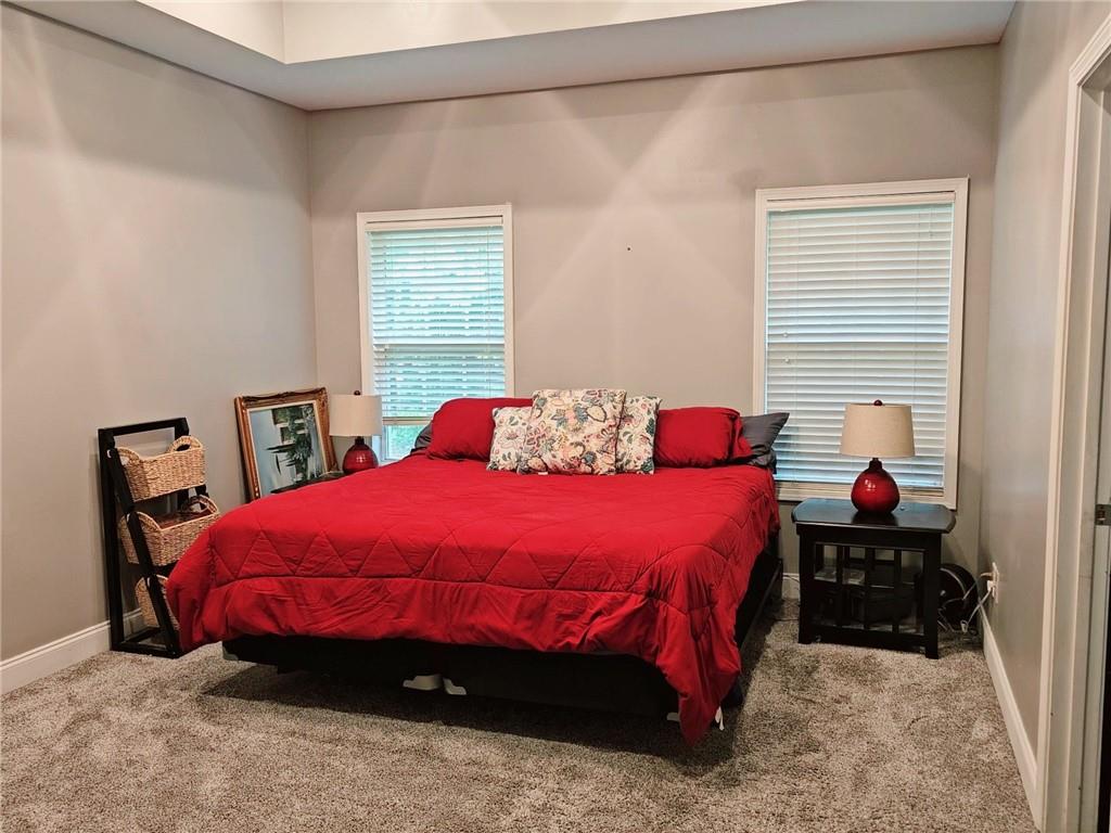 147 Crest Winds Drive Clarkesville, GA 30523 - Photo 10 of 17 a bedroom with a bed window and a chair