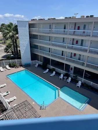 a view of a chairs and table in a patio
