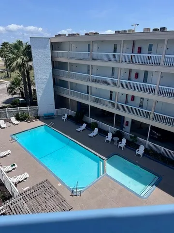 a view of a chairs and table in a patio